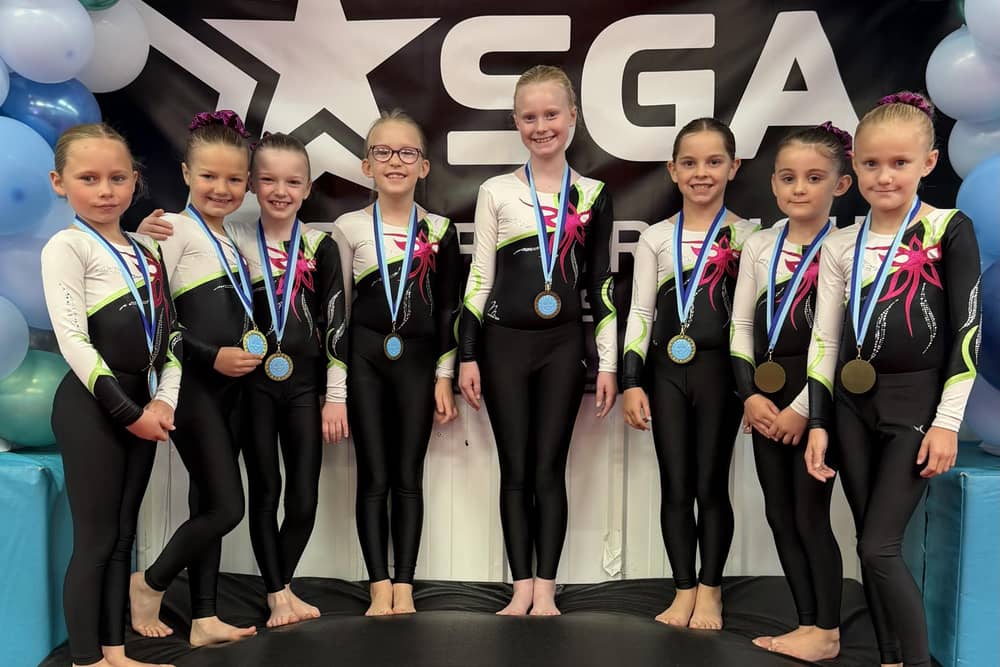 The SGA Primary Girls Level 7 squad show off their East Coast gold medals.