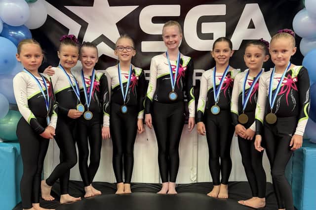 The SGA Primary Girls Level 7 squad show off their East Coast gold medals.