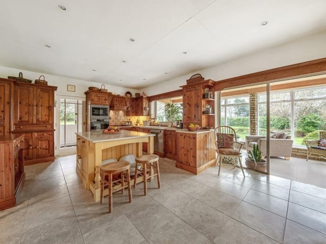 The breakfast kitchen, with conservatory to the rear.