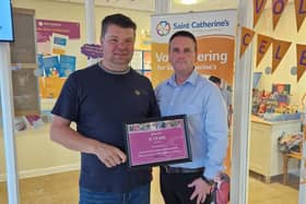 Whitby's Garry Summerson (left) is presented with an award in recognition of his 15 years' fundraising service to Saint Catherine's.