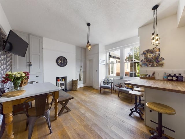Large windows allow in plenty of natural light, and the multi-fuel burning stove is a warming addition to the diner.