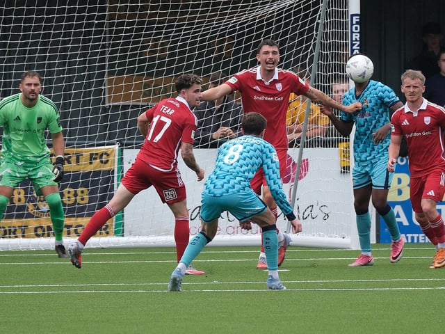 The Boro keeper Ryan Whitley, sub Dom Tear, left and Jack Waldron, right, look on while defender Jake Hull narks out his orders. Photo by Richard Ponter