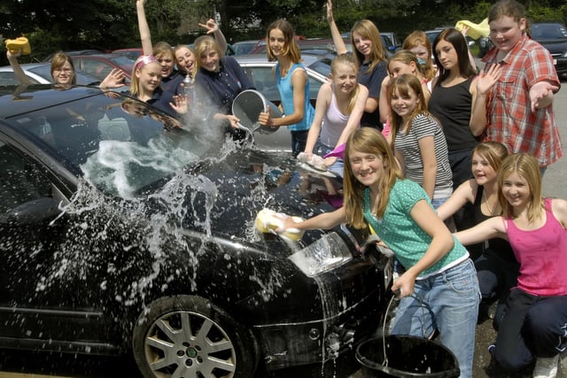 Girls get the cars sparkling in a charity car wash at Pindar School, Scarborough.