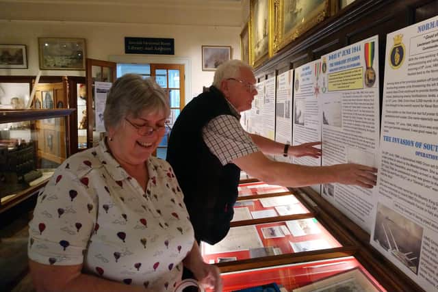 Whitby Museum's Medals Curator Julia Buck and Shipping Curator Dennis Buck prepare A Whitby Stoker's War.