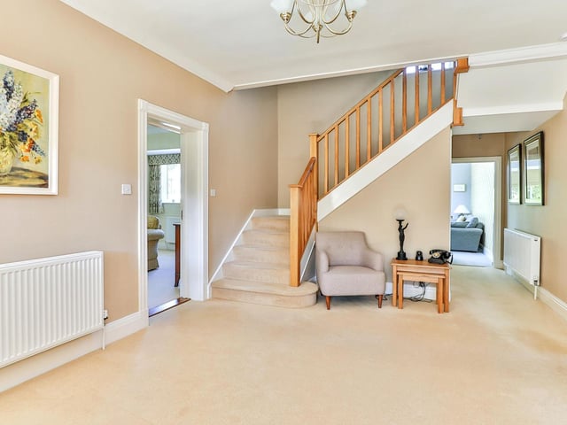 An oak staircase leads up to the first floor from the entrance hallway. Oak also features in the doors of the property.