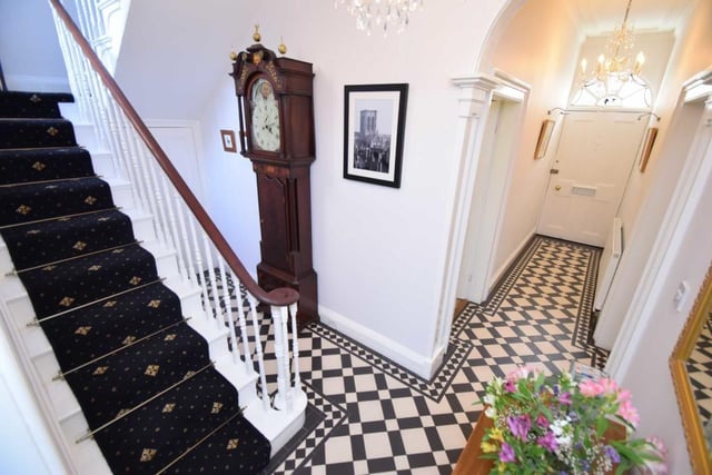 An elegant and roomy hallway leads in to the house.
