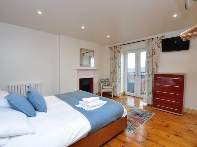 There is a double bedroom with ensuite bathroom on the ground floor of the property, while upstairs are three double bedrooms, all with rural views and en suite bathrooms. On the top floor the attic has been converted into a games room