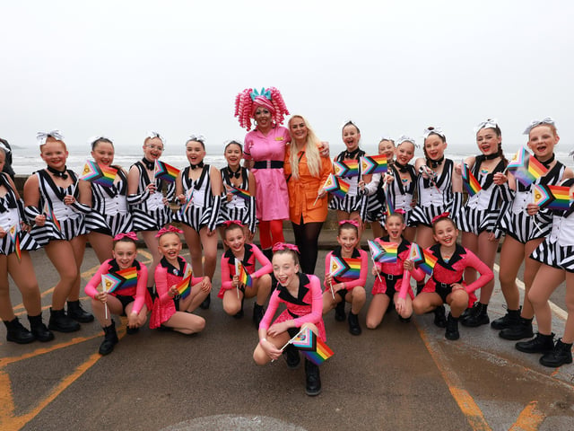 Dancers cheer outside the Spa