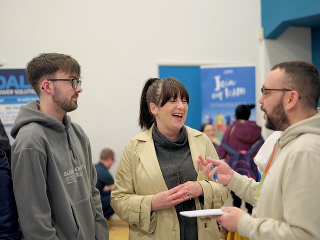 Chatting at the Beyond Housing stand