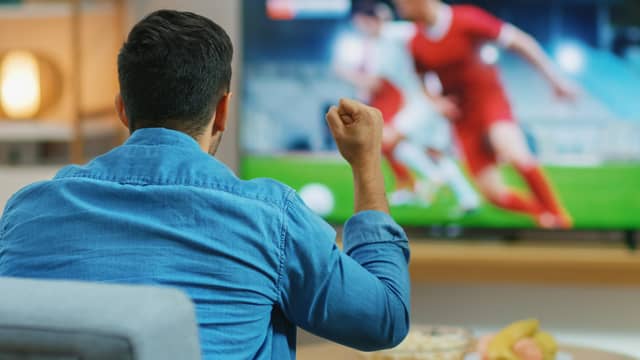 I’d rather watch the footy from the comfort of my own home these days. Photo: AdobeStock