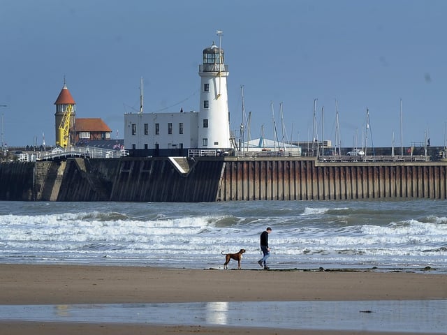 As the Coronavirus outbreak continues, lone walkers on the beach in South Bay, Scarborough.Picture by Simon Hulme.