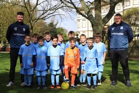 Bridlington Sharks U8 football team raised funds for the club by running the full course with a ball and passing it between themselves all the way around the 5km