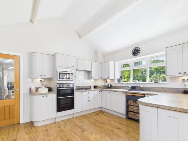 The modern fitted kitchen has integrated appliances.