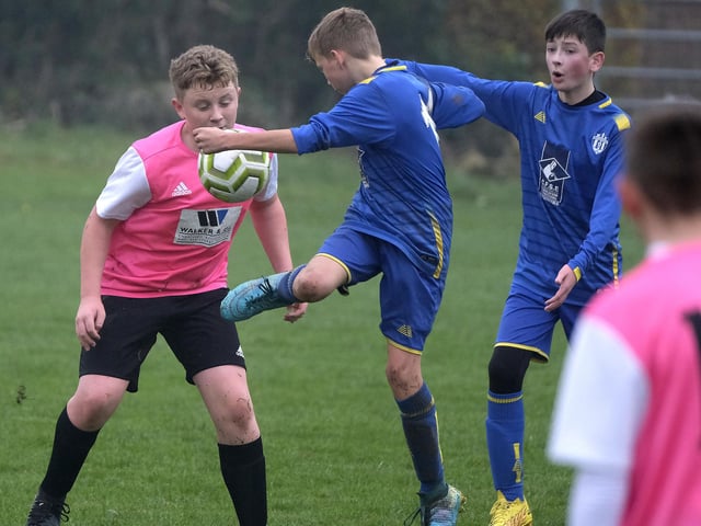 Eastfield Under-13s look to get the ball under control at Ayton Under-13s