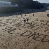 Protests in Whitby against the shellfish deaths included a message on the beach.