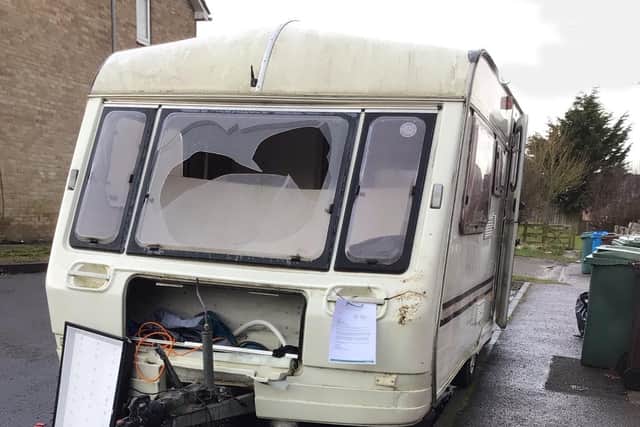 The caravan was in a dilapidated state, with smashed windows and broken panels.