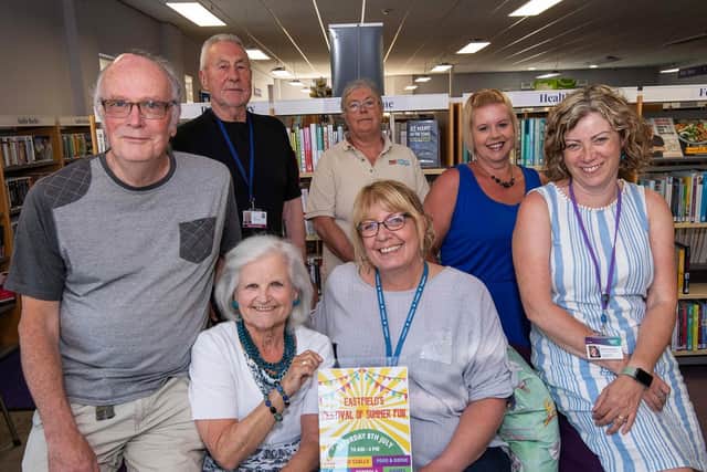 Jim Bullock (far left), Eastfield Residents Association treasurer, Sarah Cockburn (far right), of Carers Plus Yorkshire, Dorothy Bullock (sitting left), Eastfield Residents Association chair, Louise Morgan (sitting right), from North Yorkshire Council’s community regeneration team, with volunteers in Eastfield Library.