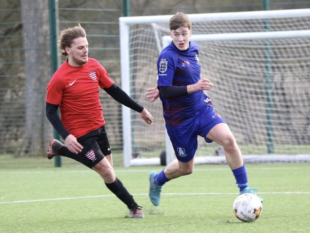 The race is on for the ball in this Division Four clash