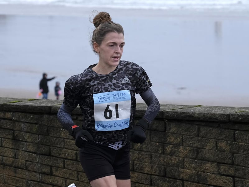The first female runner returns.