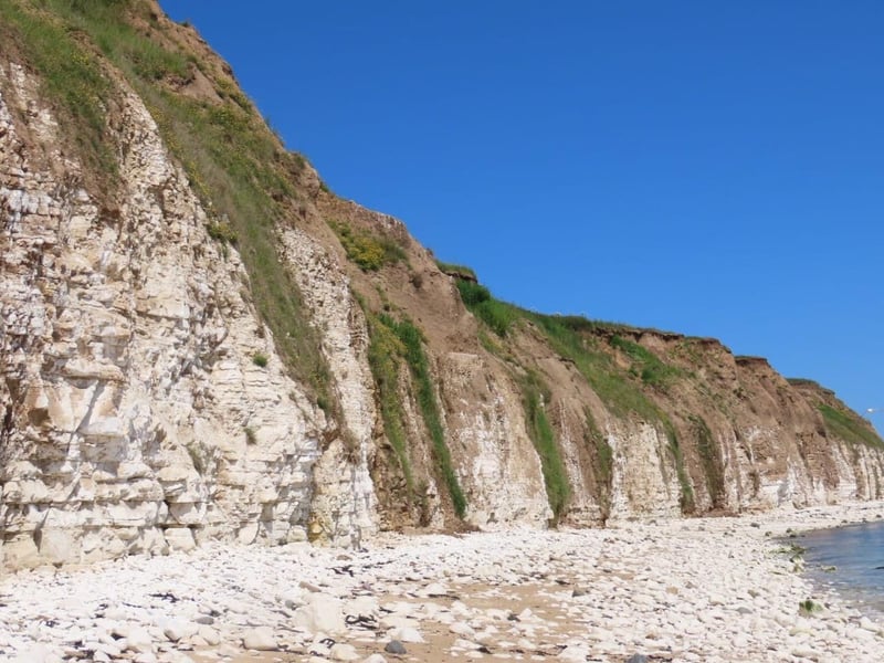Sewerby Cliffs contrasting beautifully with a brilliant blue sky.