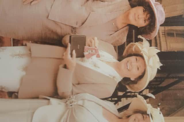 Barbara Benson-Smith receiving her MBE, with her daughter Liz Mills-Smith and Jeanette Allport Lilley.