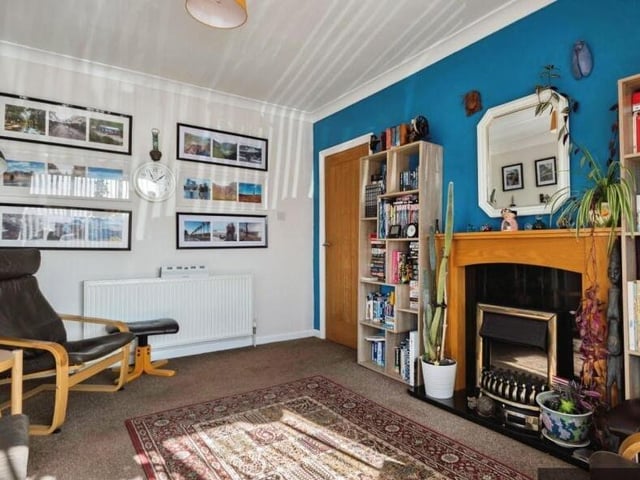 A further reception room with feature fireplace.