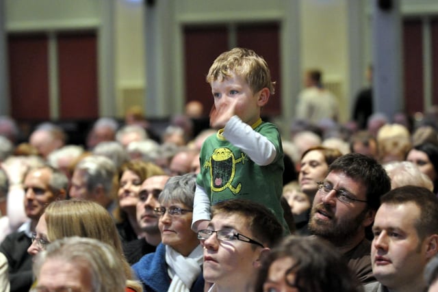 Luca Tappenden-Rowell, 3, waves to his sister Jessica, who was in the choirin 2010.