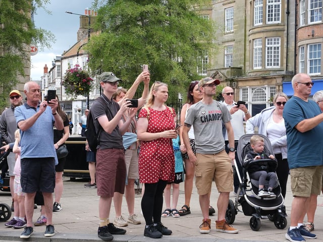 The watching crowd.