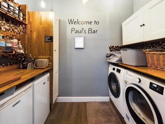 A handy utility room with units and shelving.