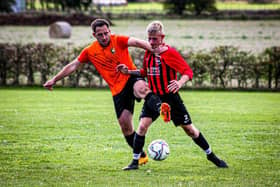 West Pier, red and black striped kit, in action against Edgehill earlier this season.