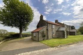 The approach to the appealing stone cottage in Harwood Vale.