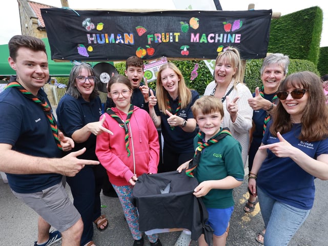 The scouts raised money with a human fruit machine