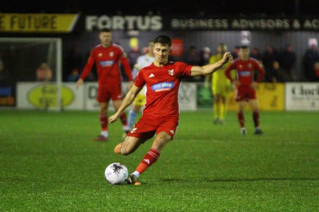 Midfielder Lewis Maloney in action against King's Lynn Town.