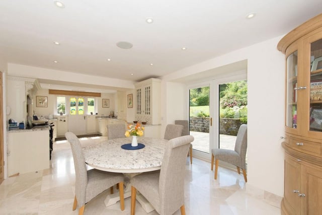 The open-plan kitchen and breakfast area lead onto a patio and terrace bringing in light and opening onto to landscape.