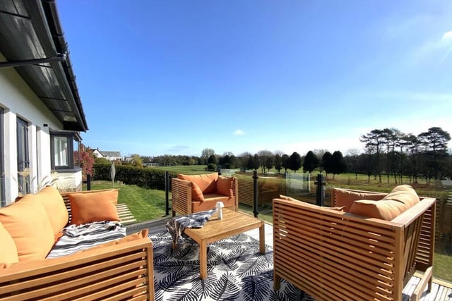 A raised, decked seating area with stunning views.