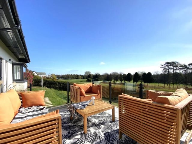 A raised, decked seating area with stunning views.