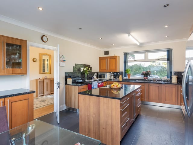 The well equipped breakfast kitchen with central island.