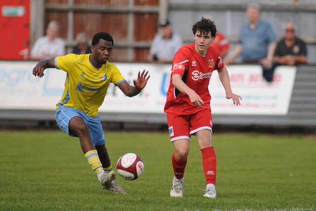 Tom Algar clears the ball from the Hallam player.