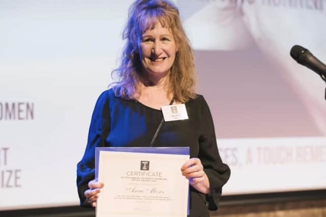Whitby artist Anne Moses with her award.