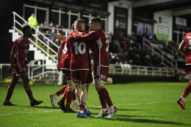 The Athletic players congratulate Harry Green after he put the visitors ahead in the second half at Spennymoor Town.