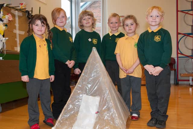 Burlington Infants School children build shelters linked to the story of Little Red Riding Hood.