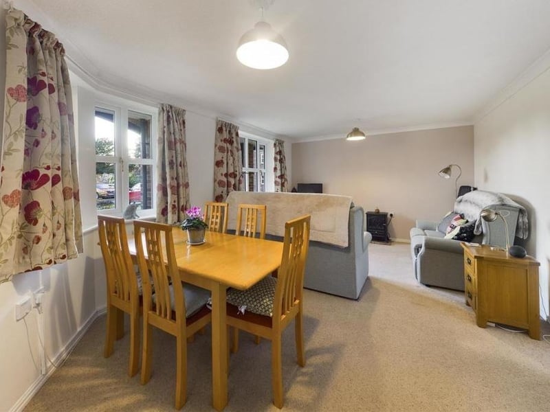 A through lounge and dining room attracts plenty of natural light through large windows.