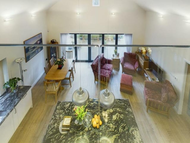 Looking down from the overhead gallery to the living kitchen below.