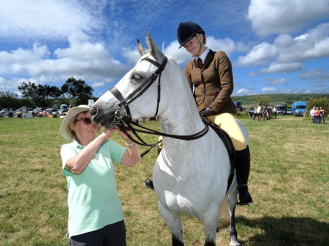 Tending to the horse.