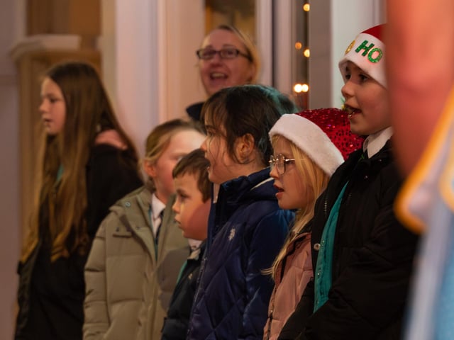 The carol singers sing