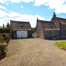 The approach to the stone cottage with garage, for sale in Kettleness.