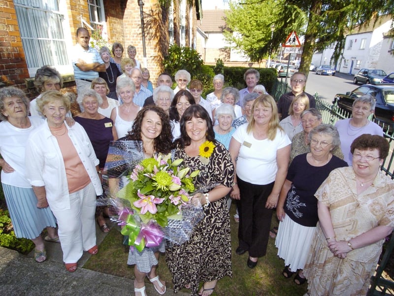 St Catherine's retail manager Sunny Stansfield is given a send off by local volunteers.