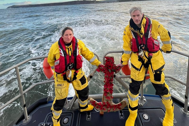 Whitby RNLI lay poppies at sea.