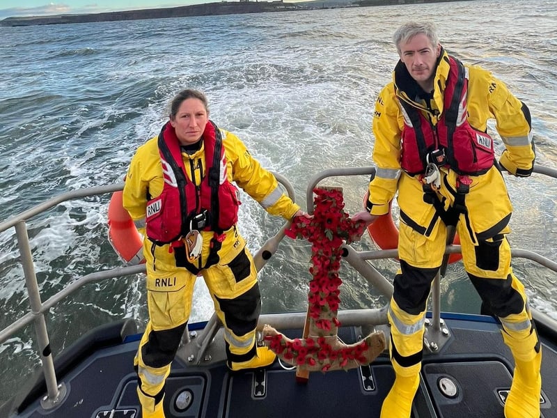 Whitby RNLI lay poppies at sea.