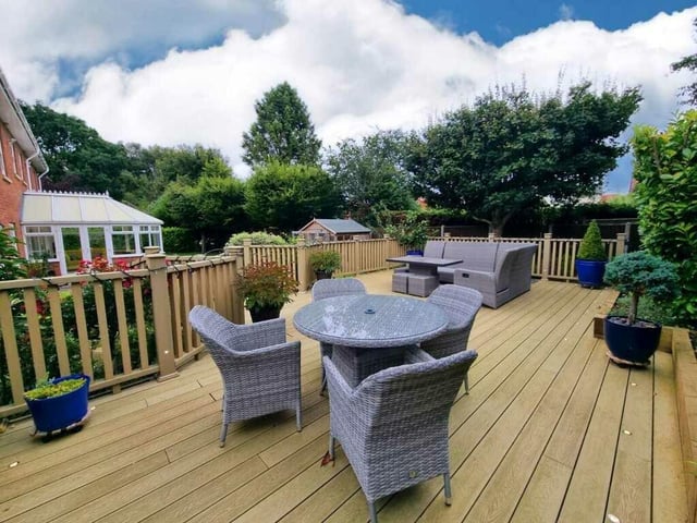 This seating area with composite decking has mood lighting, so ideal for entertaining.